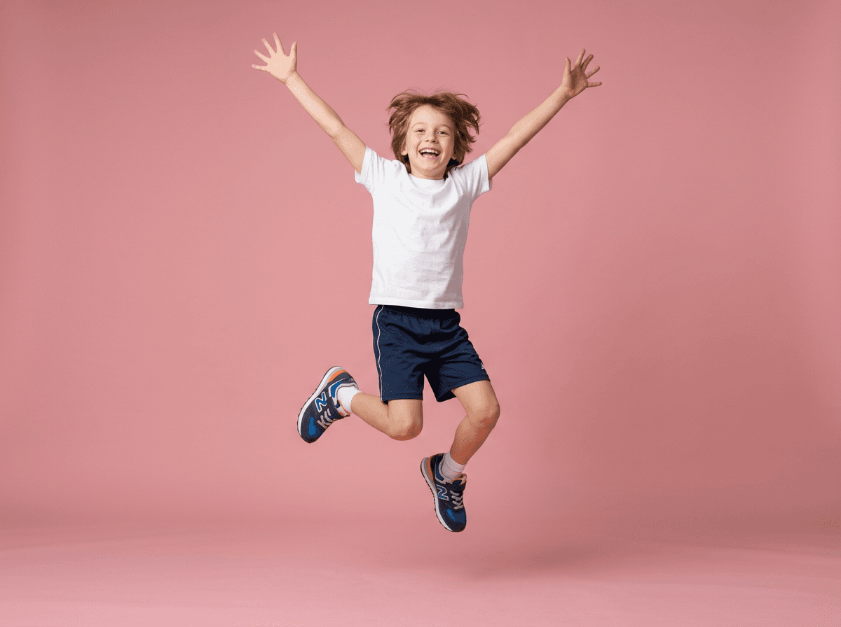 A happy young child jumping in the air